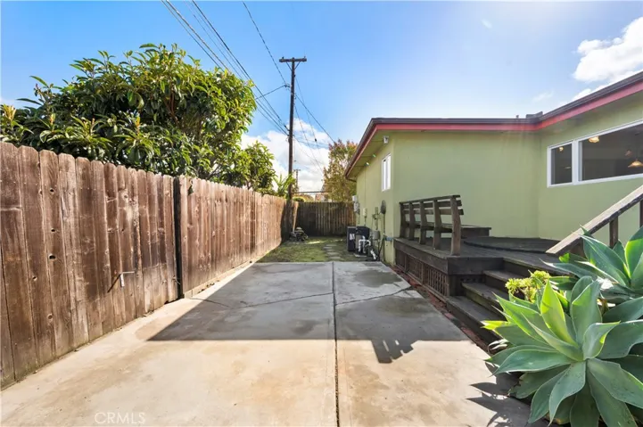 Cement Patio Adjoins Grass Area