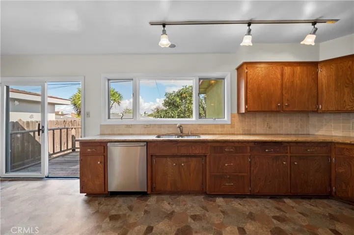 Sliding Glass Doors Lead to Deck and Backyard