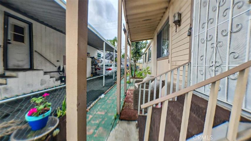 Front entrance with metal screen gate. Staged photo
