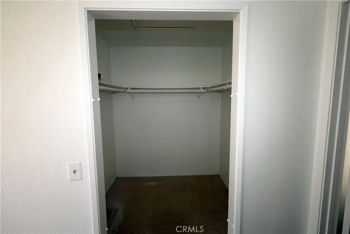Primary Bedroom 1: walk-in closet.