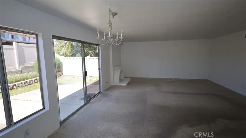 Living Room: Sliding glass doors and windows bring in tons of natural light.