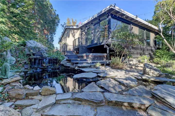 Southwest corner of the patio looking off on the waterfall and pond.