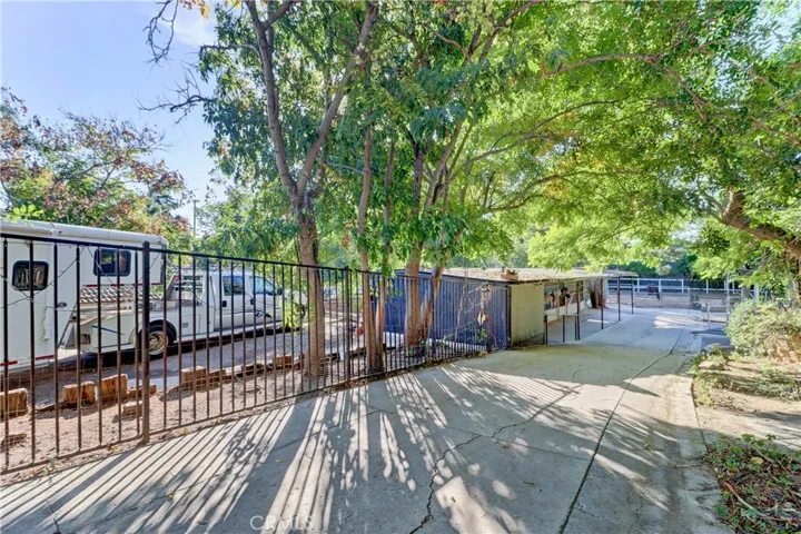 Separate entrance for lower yard with trailer parking