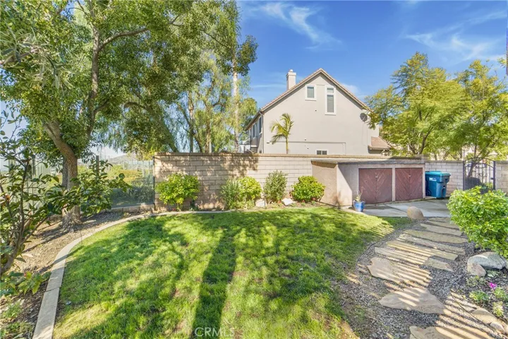 This yard offers space to play and entertain as well as great built in storage space.