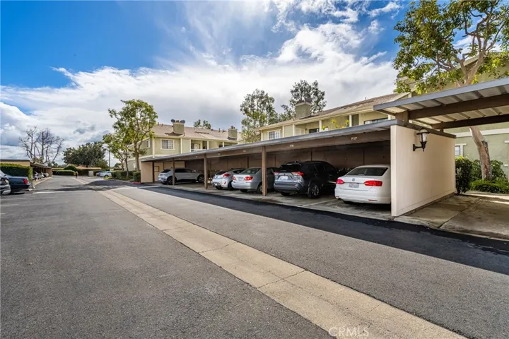 Your assigned carport space will be where the white sedan is parked. Mailboxes are in the covered community entrance just to the right of the white car.