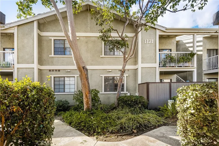 Standing in the walkway between carports. The conveniently located mailboxes for your building are in the covered walkway, and that is your very private patio just to the right.