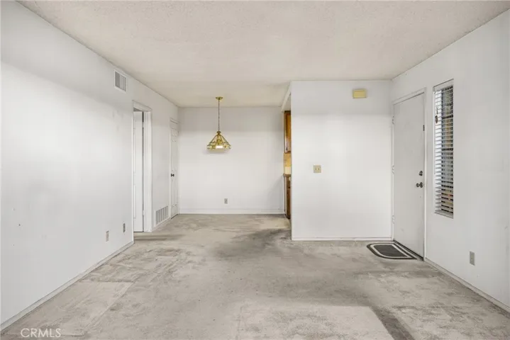 View of the dining room area and closet on the back left while standing in the patio slide.