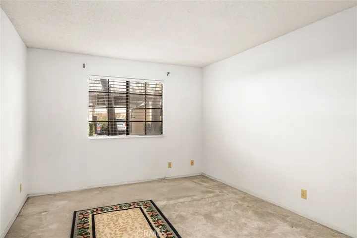 A nice sized bedroom with a window for additional like and fresh air.