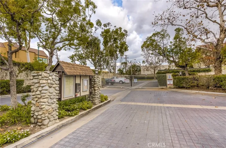 This is a picture of the very attractive gate protected entrance area. The clubhouse, meeting room is just to the right and if you are having an activity in that room your guest can enter without having to have access to the entire community.