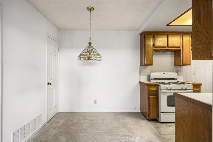 Closer view of the dining room and entrance to the galley style kitchen on your right,