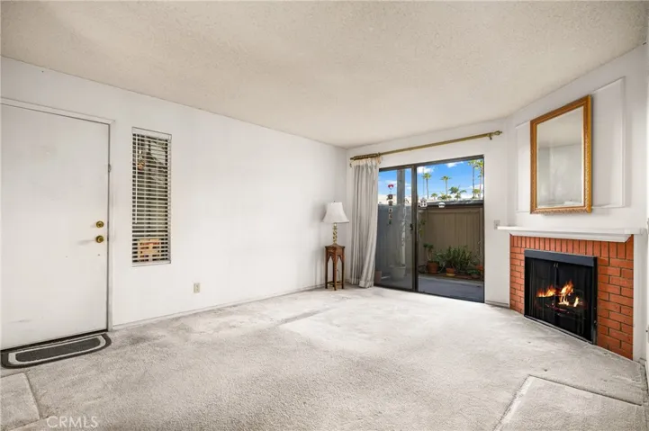 Living room from the dining room area and you can now see the front door mentioned in the prevous photo