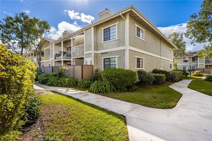 A picture of the building that your unit is located in. Concrete sidewalks through the community, providing easy access to 1 of the 2 in ground spas, the pool, the grounds, or the meeting room.
