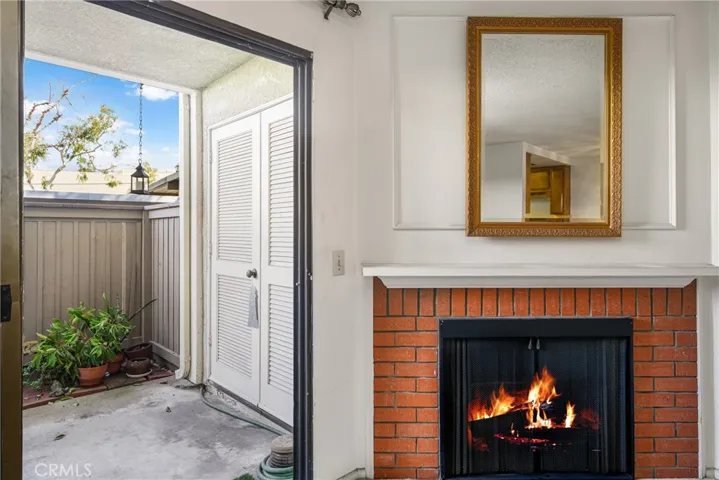 The corner fireplace feature is in your living room and adds to the warmth and charm of this living space. The fire above has been photoshopped in this photo.