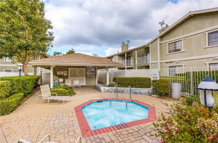 Better view of the in ground spa in or near the pool in the previous photo. There is a 2nd gated area in the community with just an in ground spa, no pool.