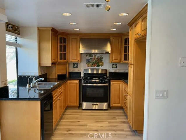 Updated kitchen with new stove and granite counters.
