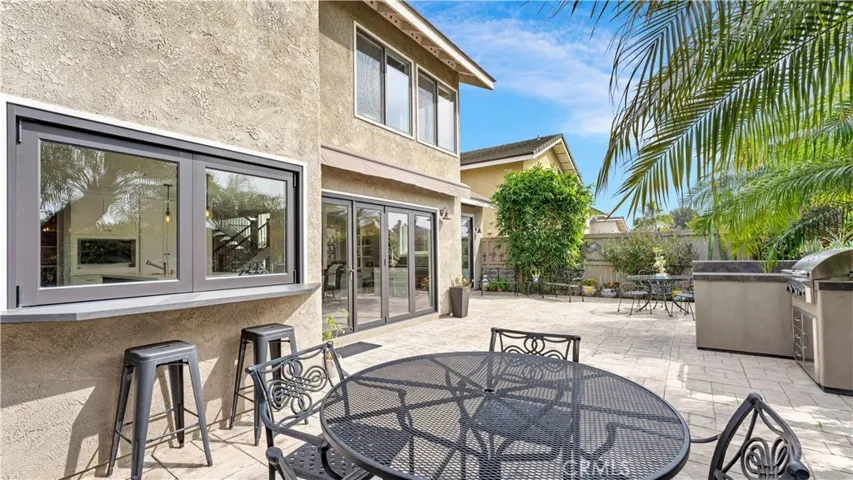 A fantastic patio! Espresso painted windows and folding doors! The kitchen has a convenient pass through window.