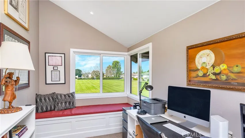 Let's go upstairs. The middle bedroom is currently being used as an office and has a built in desk, wall length bookcases, window seat and large corner window. What a view, too! That is Lemon Grass pool in the distance.