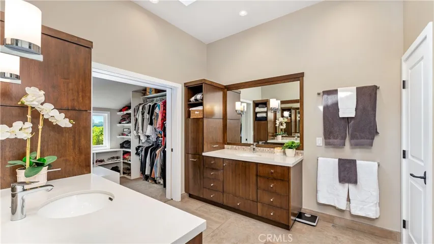 Such a comfortable design with 2 separate sinks and dressing areas plus a large walk-in closet.
