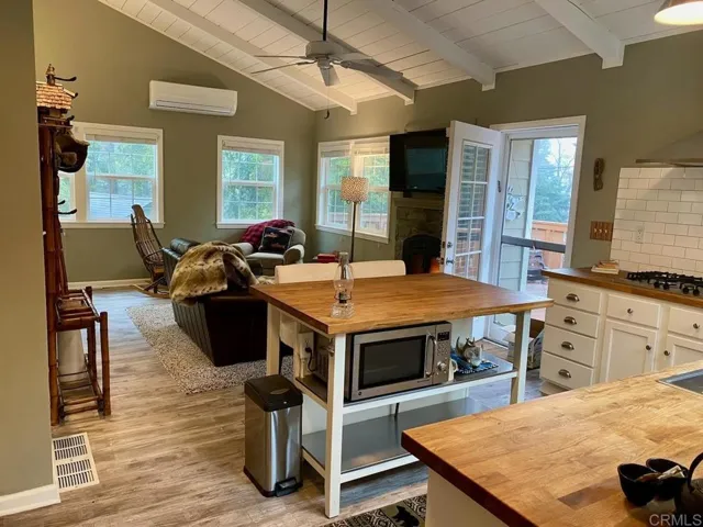 Under-counter microwave in the convenient kitchen island.
