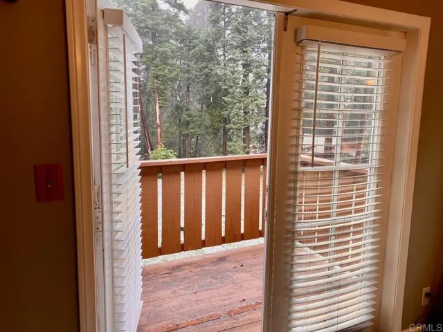 French doors lead you to the balcony off the dining area.