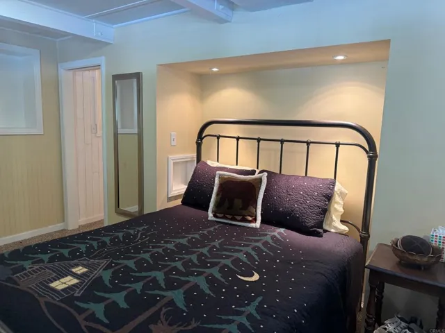 Reading lights above the bed with shelves on each side for your favorite book.