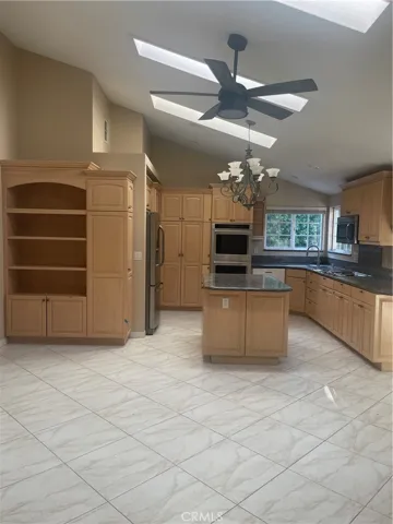 triple skylights in kitchen for enhanced natural lighting
