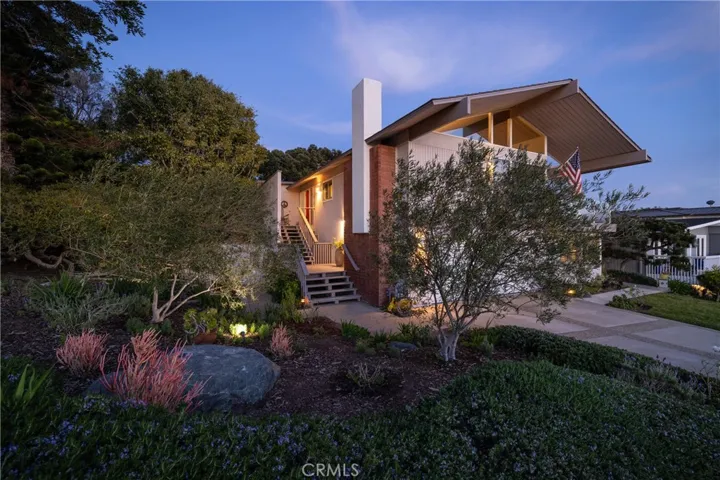 Charming garden design embraces front elevation