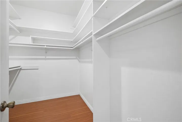 Primary bedroom walk-in closet