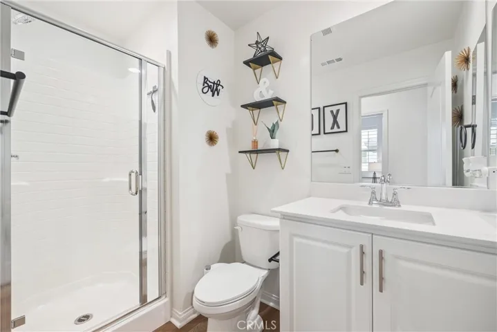 Downstairs bathroom with walk-in shower for guests