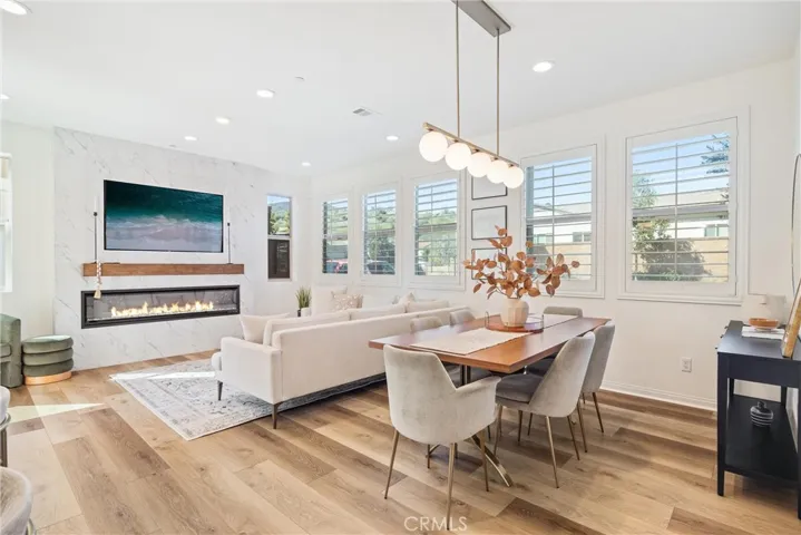Custom feature wall with electric fireplace and recessed TV