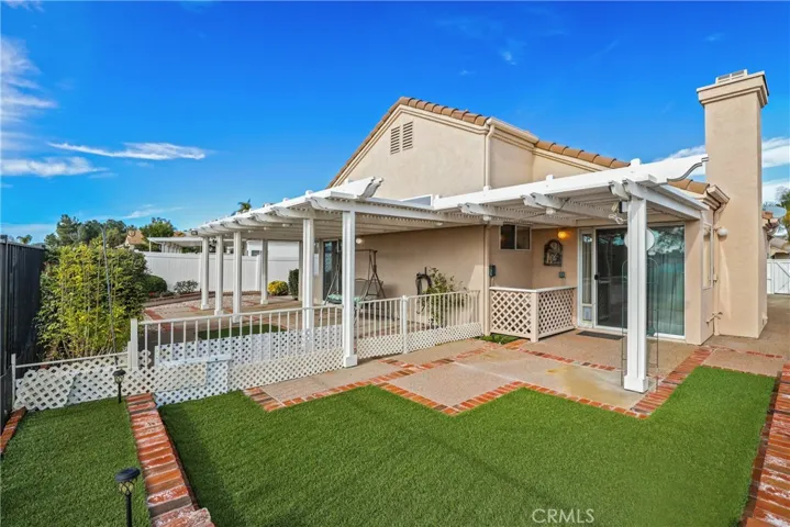 Your backyard has artificial turf and easy-care plants.
