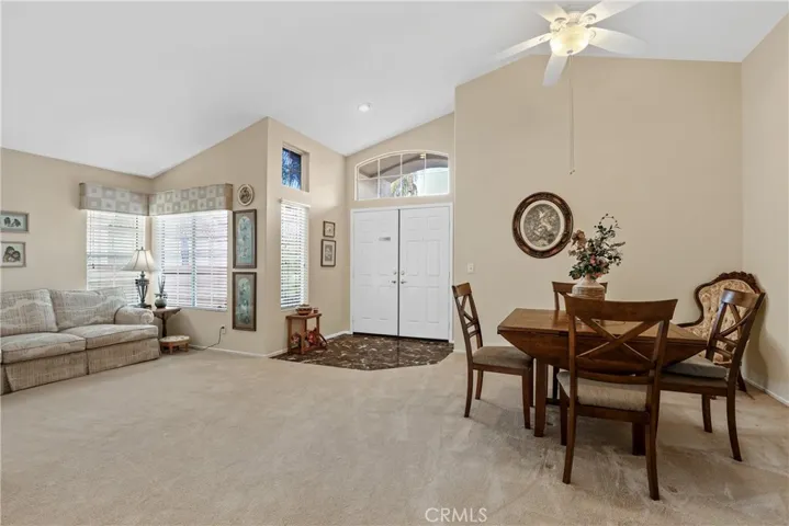 Your formal living/dining room with vaulted celing and lots of natural light.