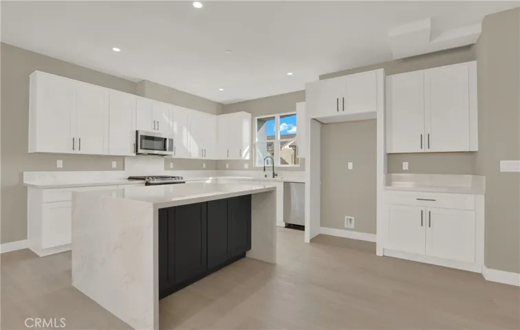 Kitchen with Large Waterfall Island