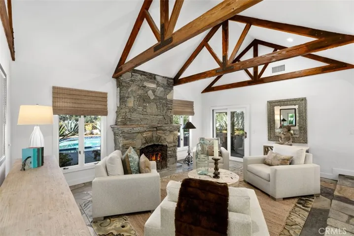Living Room Features Beautiful Wood Beamed Ceilings