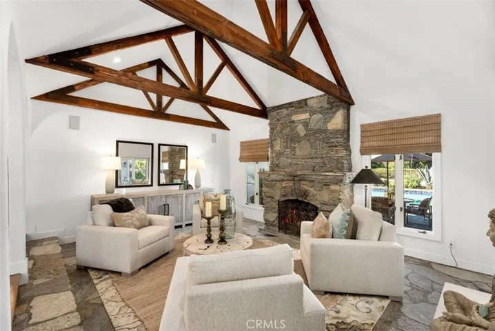 Living Room Features Stone Fireplace