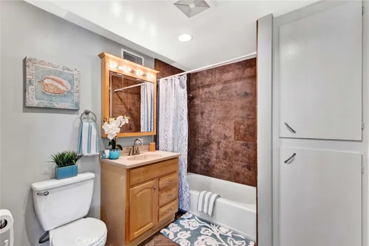 Upstairs Bathroom has Tile Flooring and Tub/Shower Surround, Plus Linen Cabinets