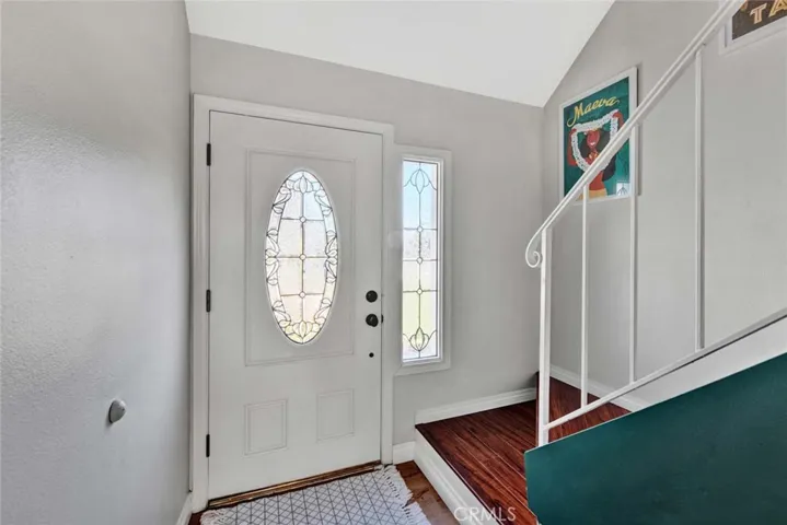 Front Door with Beveled Glass and Matching Sidelight Opens to Formal Foyer Entry