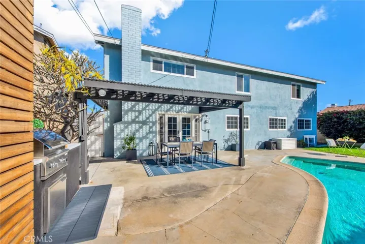 Newer Slat Wood Privacy Wall, BBQ Center with Brand New DCS BBQ, Covered Patio, Pool, Lawn, and More!
