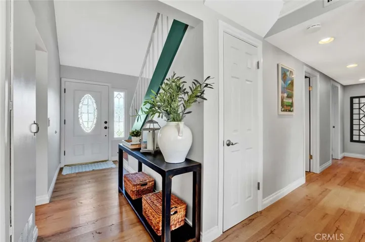 Front Door with Beveled Glass and Matching Sidelight Opens to Formal Foyer Entry