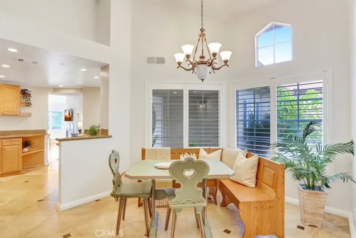 The abundance of windows offers views of the front courtyard and floods the morning room with lots of natural light.