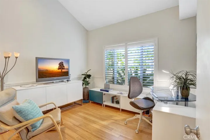 Also located on the main level, the second bedroom is generous enough to accommodate large furniture with room to spare and looks out into front courtyard.  The guest bath is conveniently located just steps away.