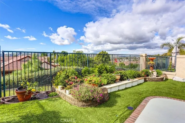 Beautiful open views from the spacious back patio & yard with low maintenance turf.