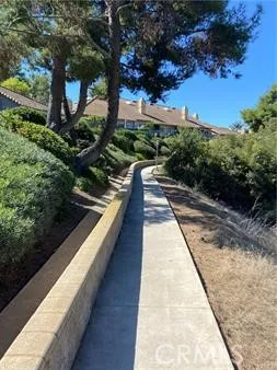 Mesa Vista's "Paseo" is a paved walking path that runs between the community and the golf course below.