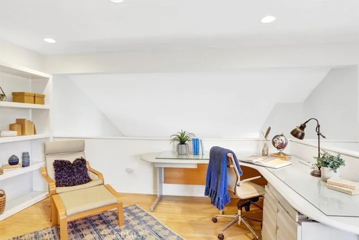 Large loft with pony wall overlooking the living room below, is a great "flex" space for many possibilities: home office, gym, playroom or enclose and create a third bedroom?!