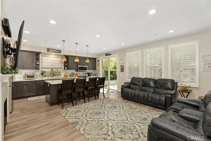 Spacious kitchen with center Island that sits 4. Entry to backyard