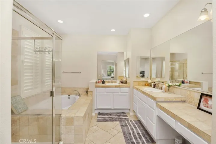 Master bathroom with walk in shower / tub and separate water room.