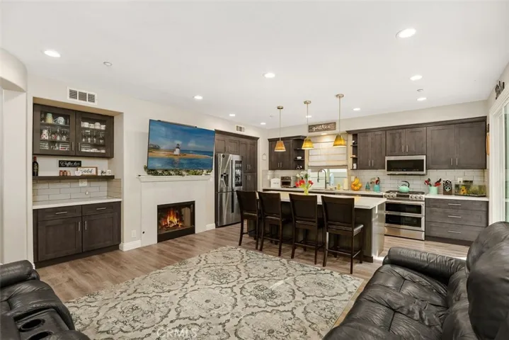 Open Concept family room with fireplace and coffee bar