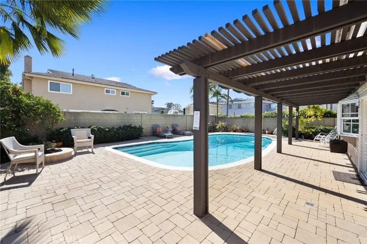 Outdoor dining under the covered patio is great for hosting parties & special occasions ~ Plus an outdoor fire pit where you can relax and enjoy at the end of a busy day~