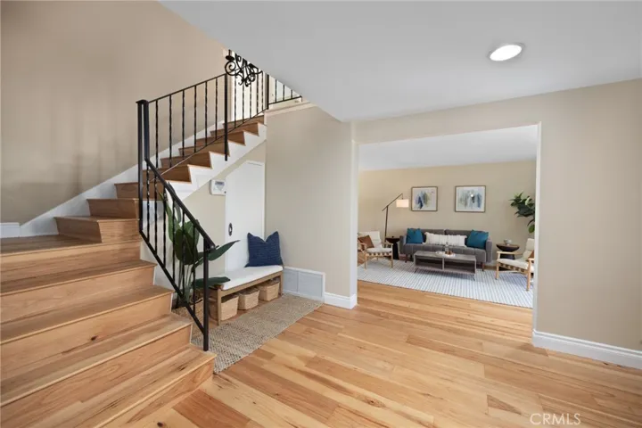 Welcome Home ... The foyer and lower level of this home is showcased by Exquisite hickory wood flooring throughout, including the staircase and upstairs landing...