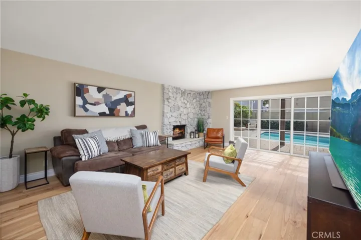 Stunning great room overlooks the spacious backyard through dual-pane windows and embraces an array of sunshine and natural light!